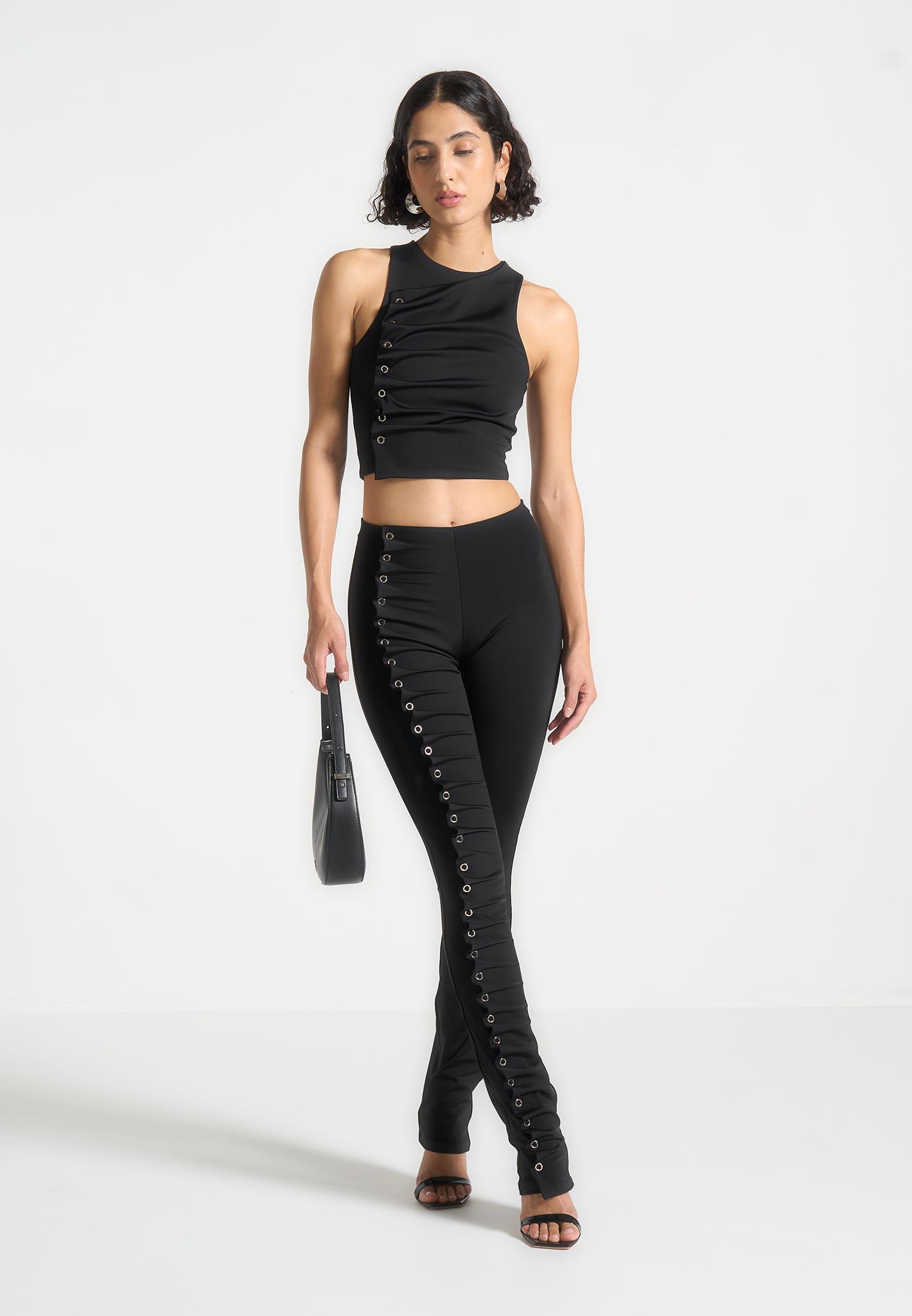 eyelet-detail-tacked-leggings-black 