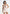 Christelle - Cowl Halter Open Back Rosette Mini Dress - Champagne